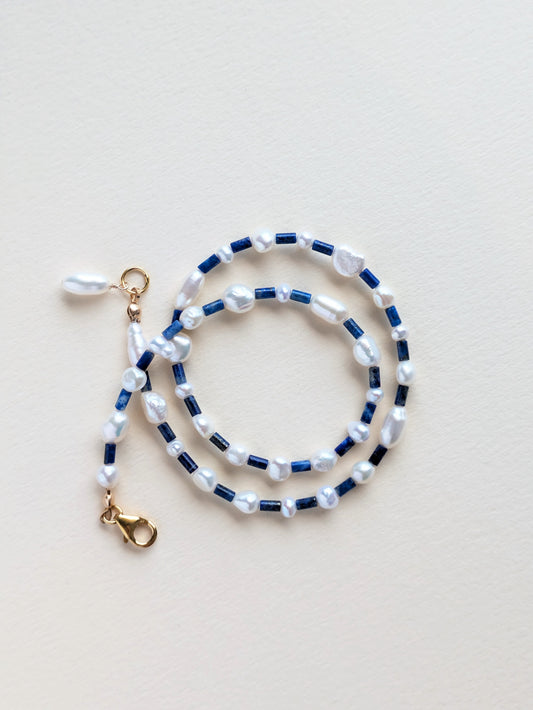 Lapis lazuli in pearl choker, wrapped.