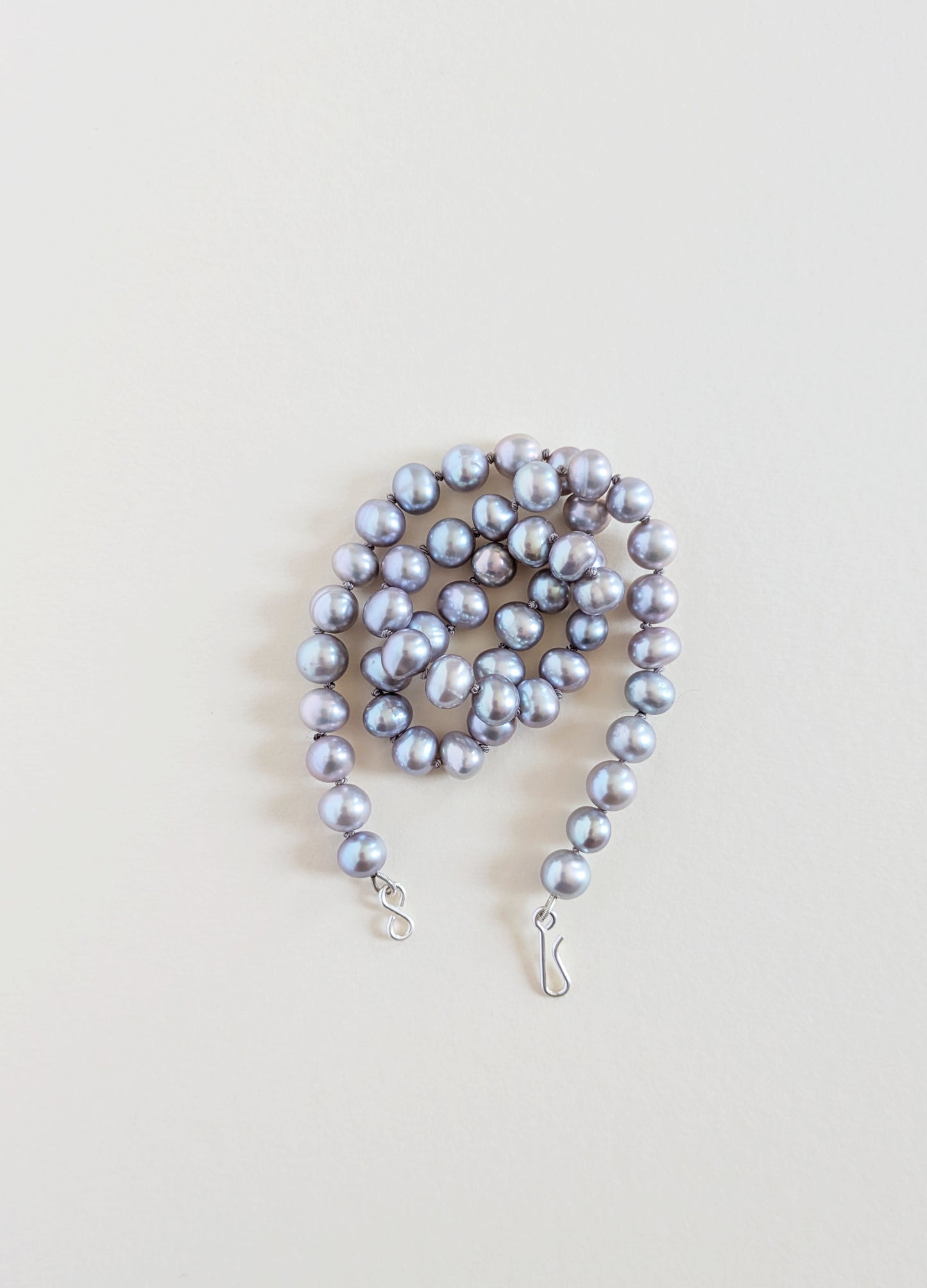 Grey pearl necklace wrapped.