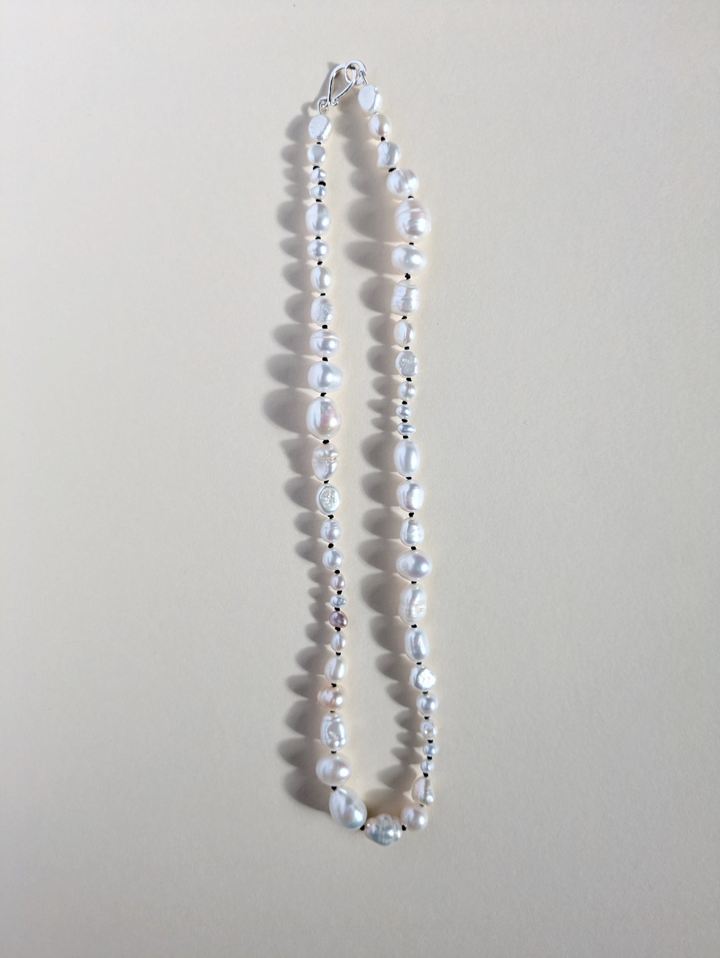Irregular pearl necklace strand.