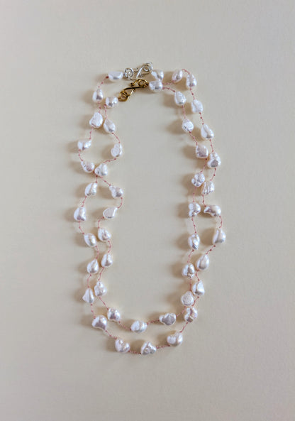 Pearl necklace on a light beige background and its varaint.