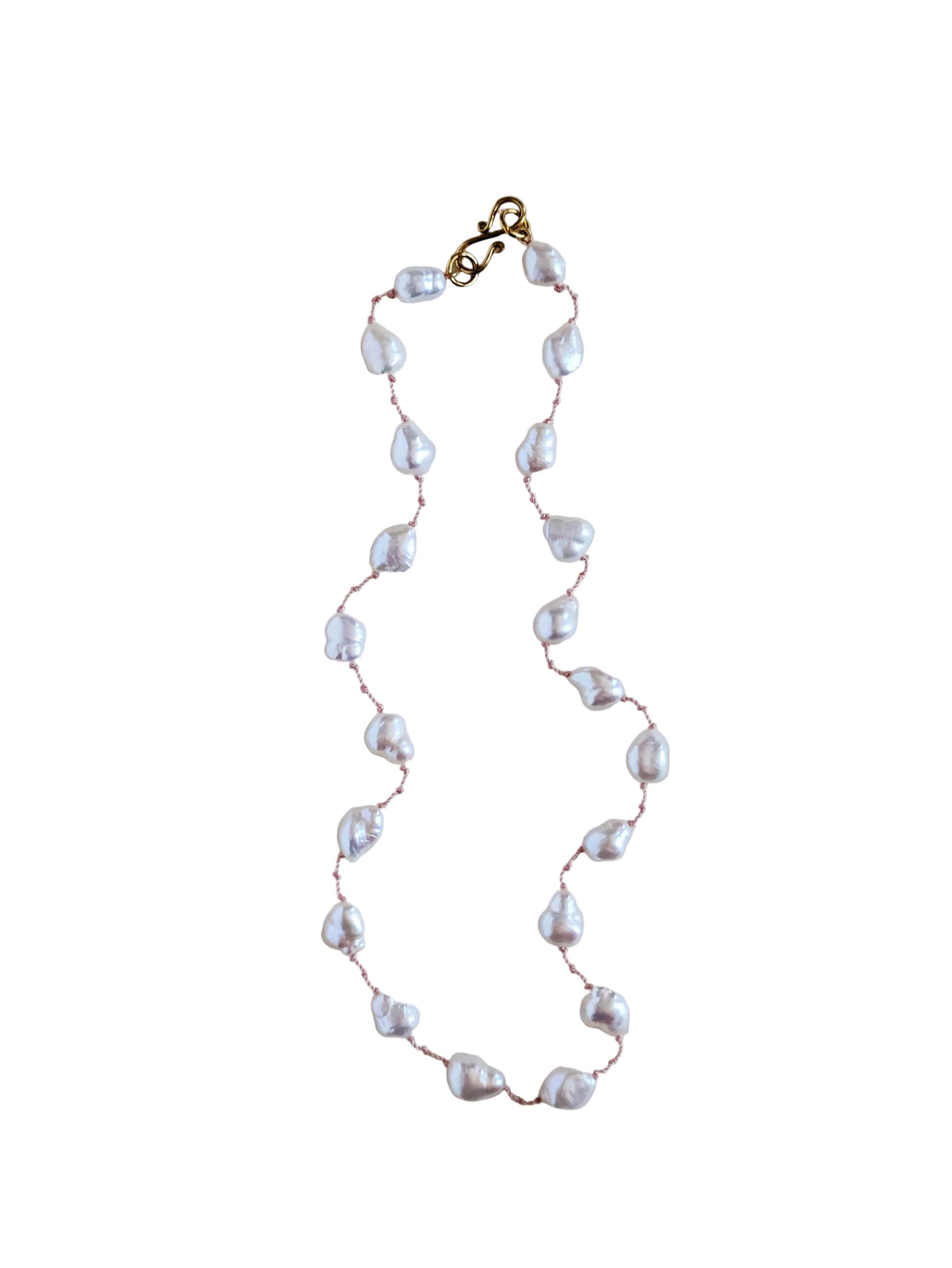 Pearl necklace with gold clasp on a white background