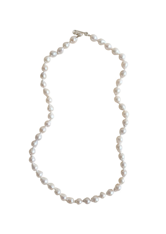 Pearl necklace on a white background