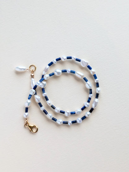 Lapis lazuli in pearl choker, wrapped.