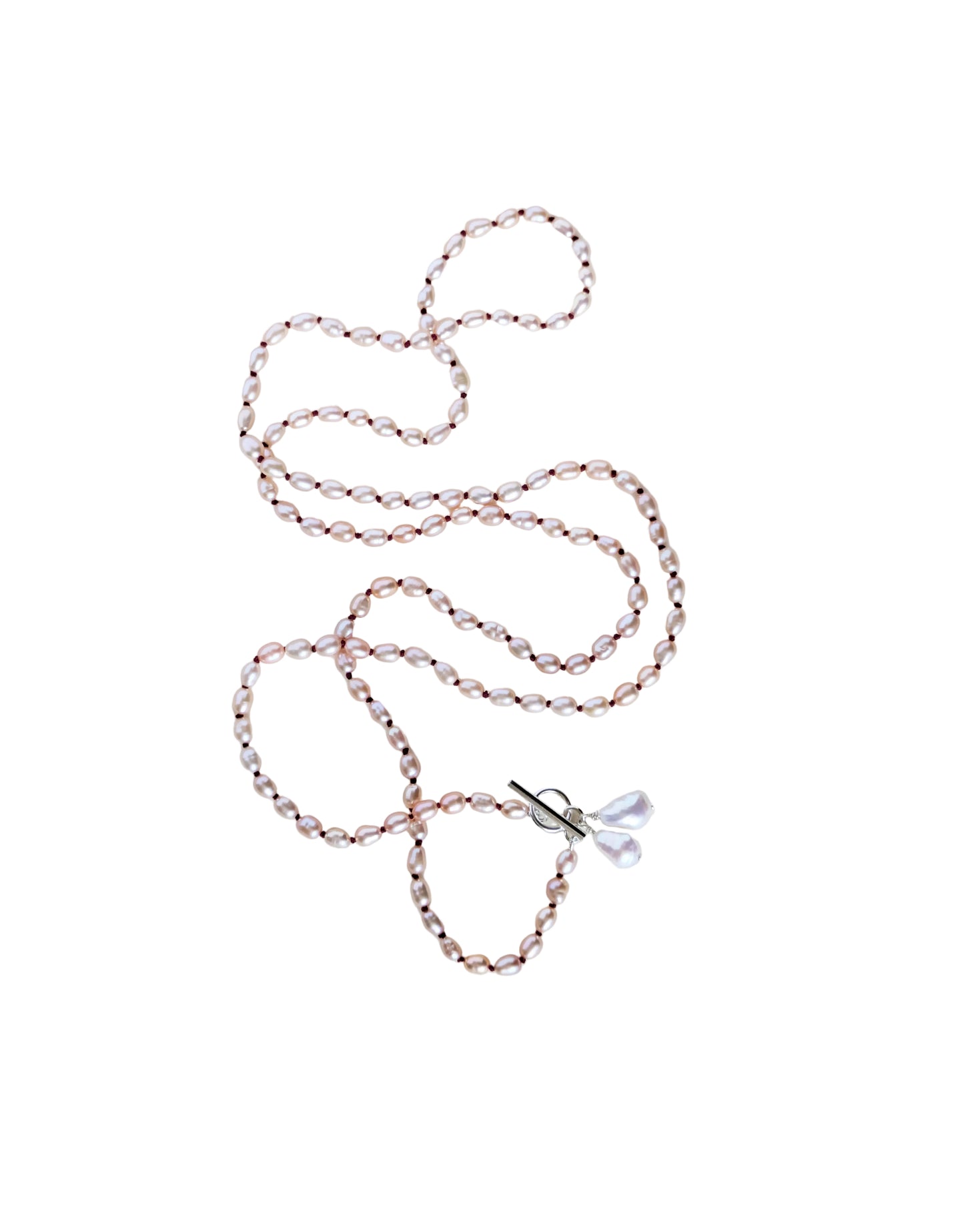 Long pink pearl necklace Vesper on a white background.