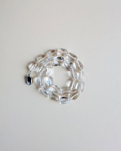 Lucite bead necklace with a silver clasp.