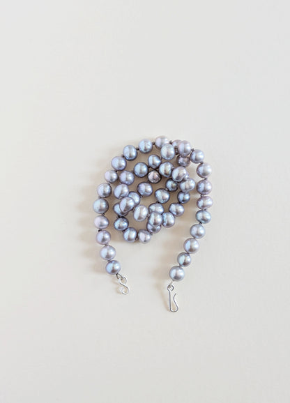 Grey pearl necklace wrapped.