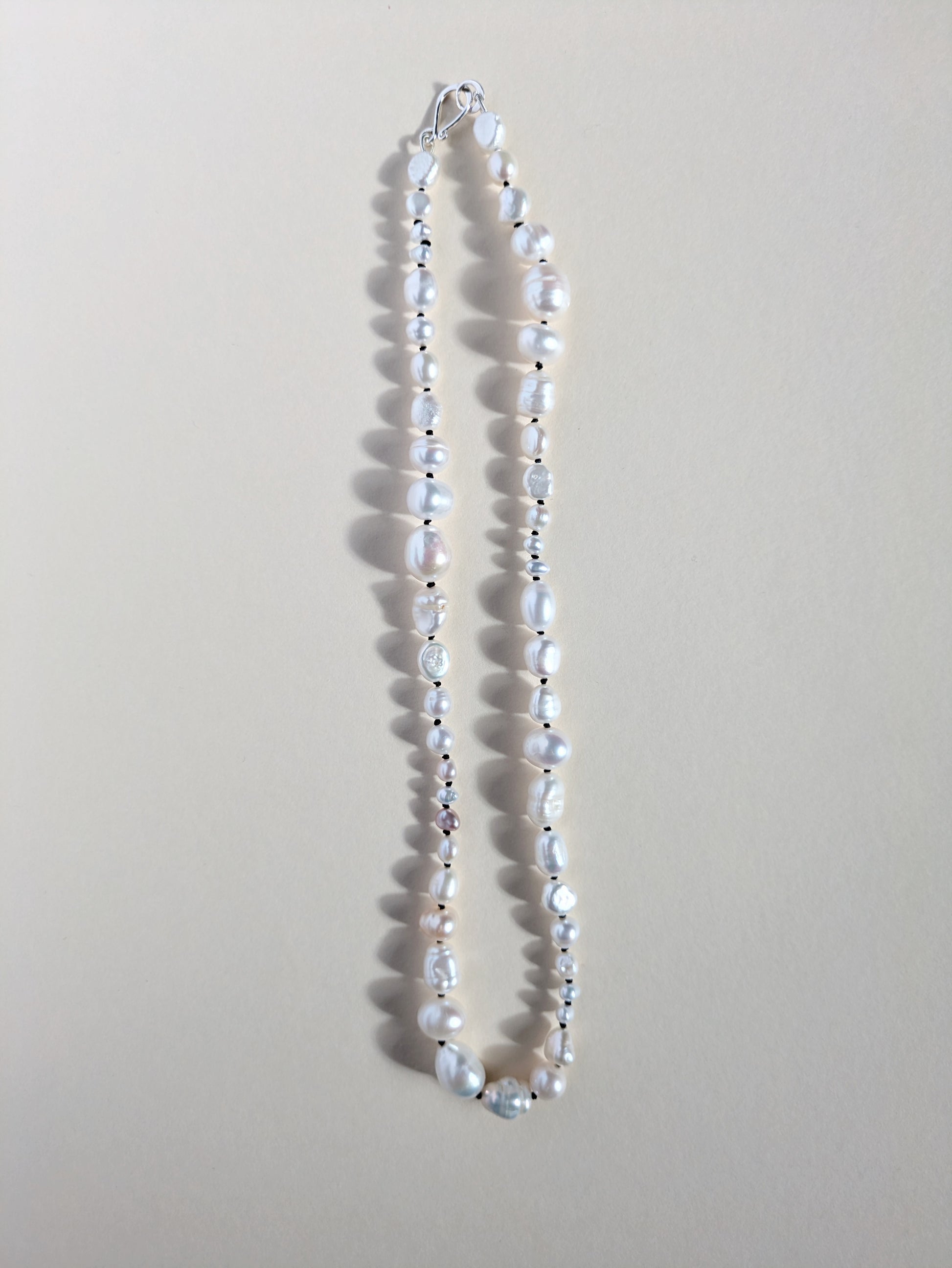 Irregular pearl necklace strand.