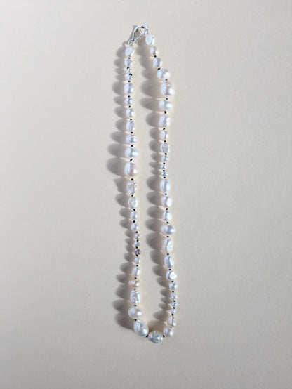 Irregular pearl necklace strand.