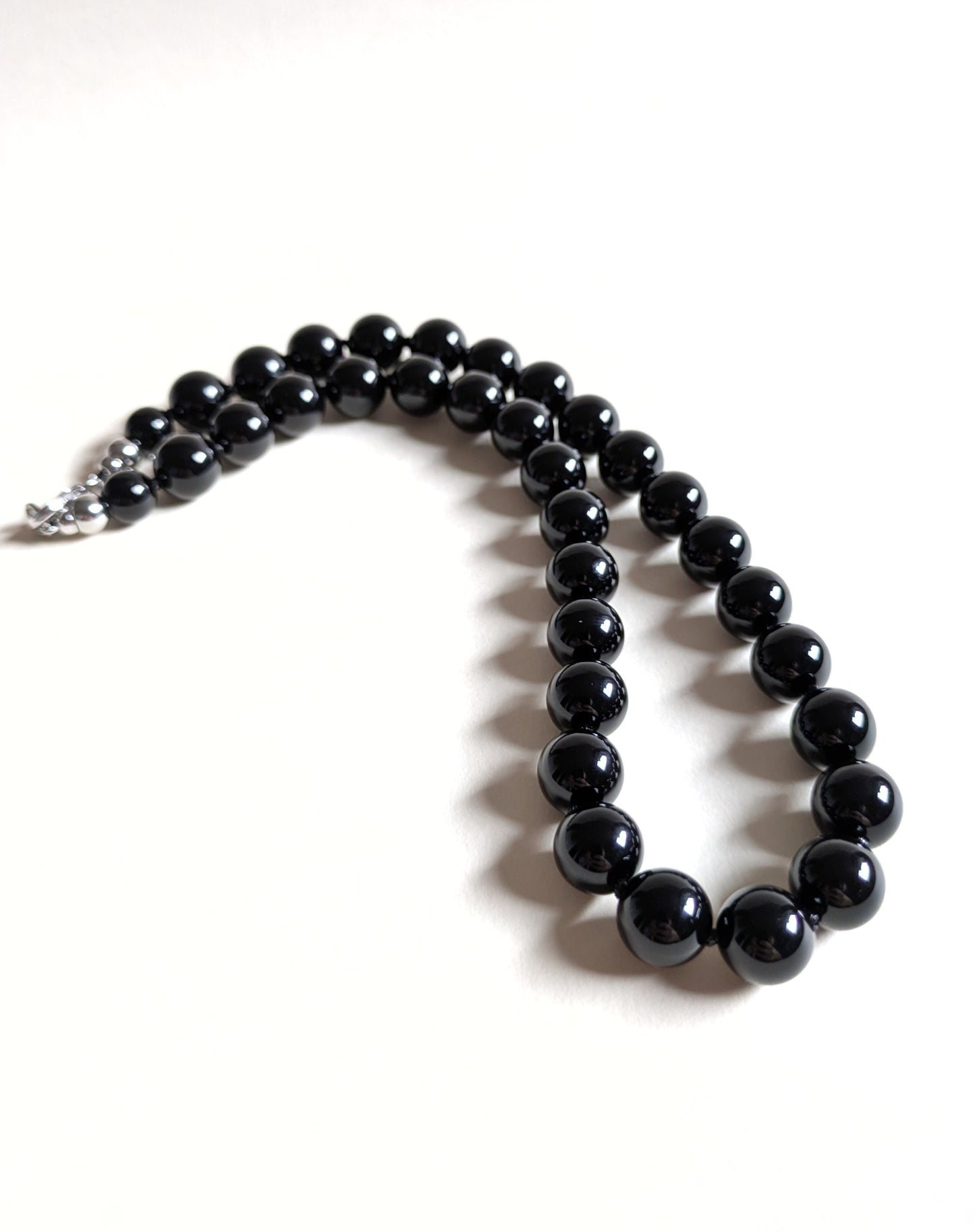 A strand of black onyx necklace.