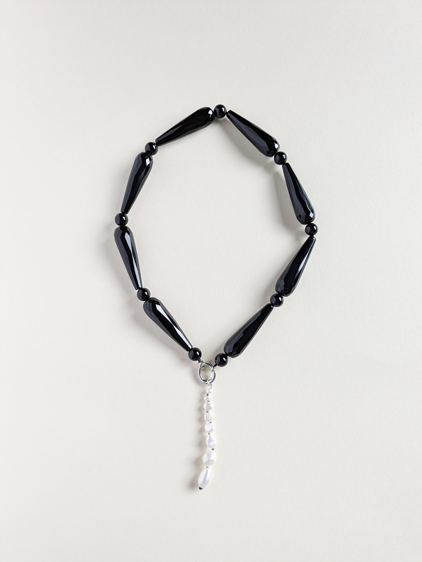 Onyx necklace Drama with a pendant.