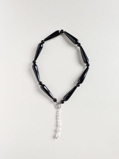 Onyx necklace Drama with a pendant.