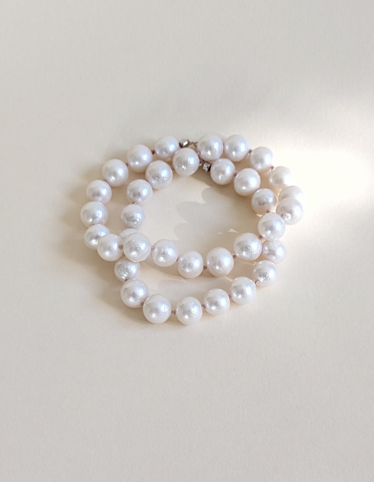 Baroque pearl necklace wrapped twice.