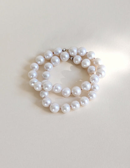 Baroque pearl necklace wrapped twice.