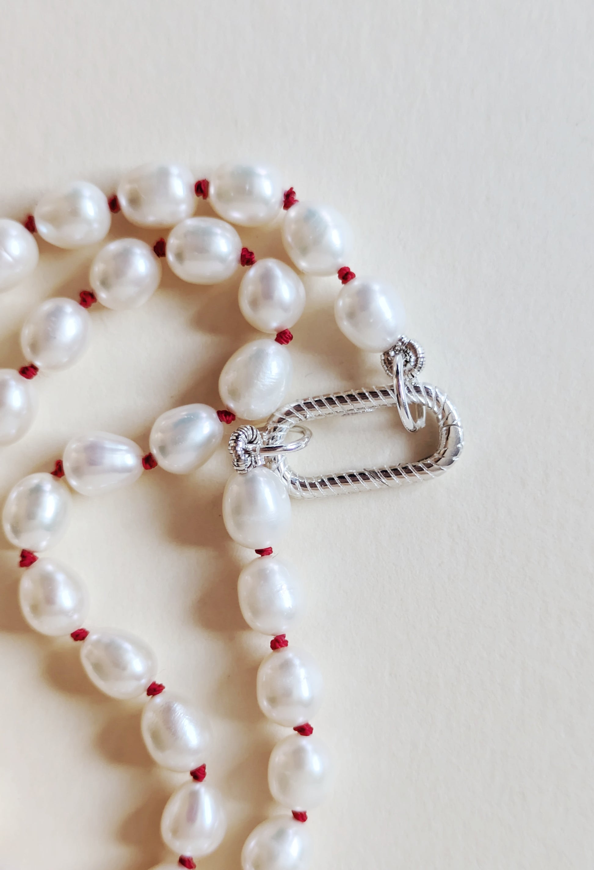 Sterling silver clasp on a pearl choker.