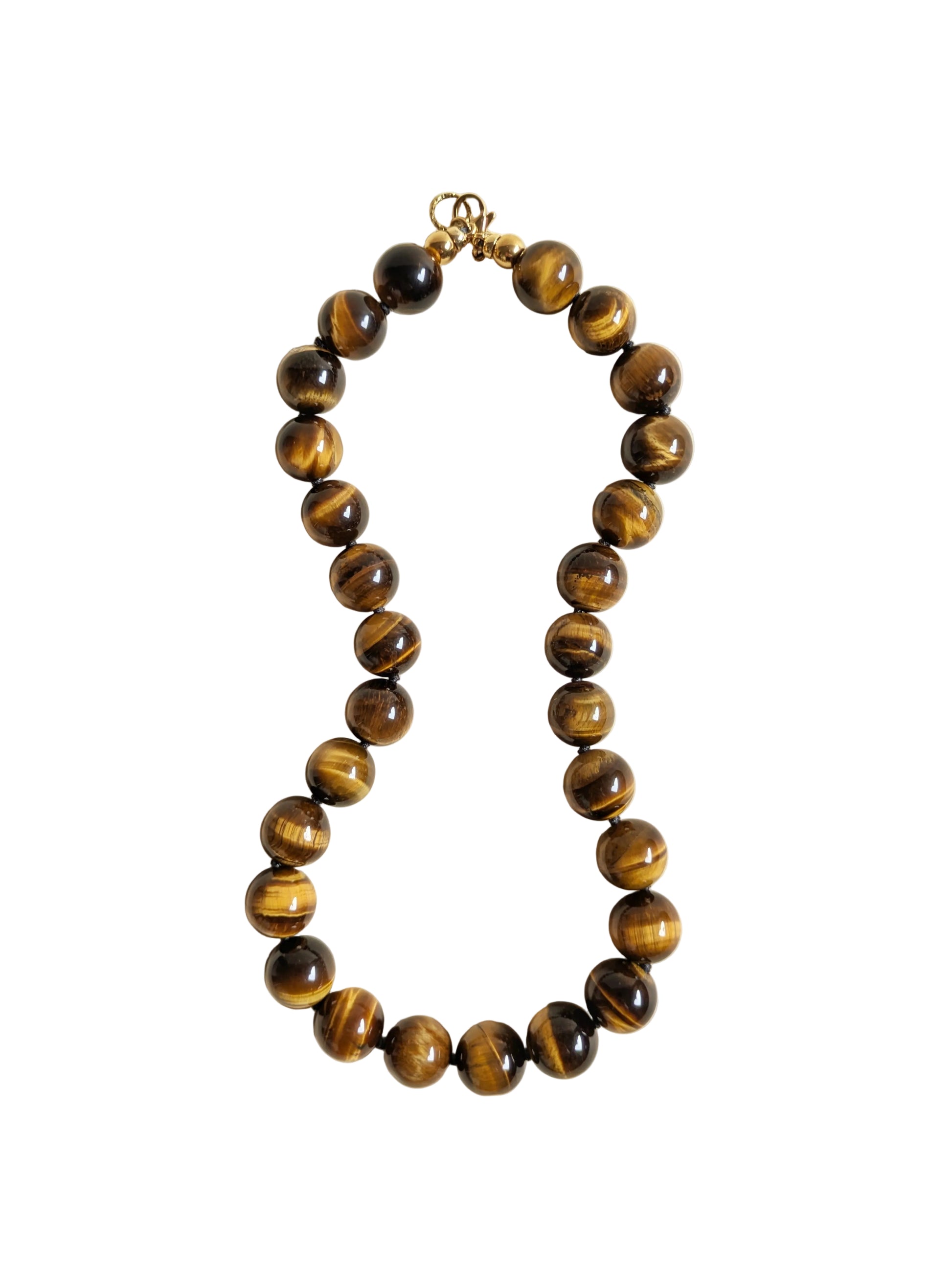 Tiger eye gemstone necklace on a white background.