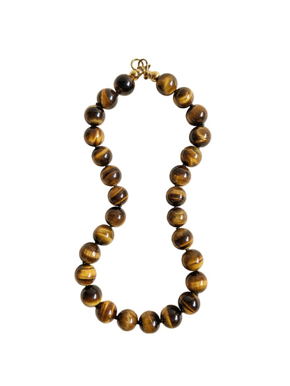 Tiger eye gemstone necklace on a white background.