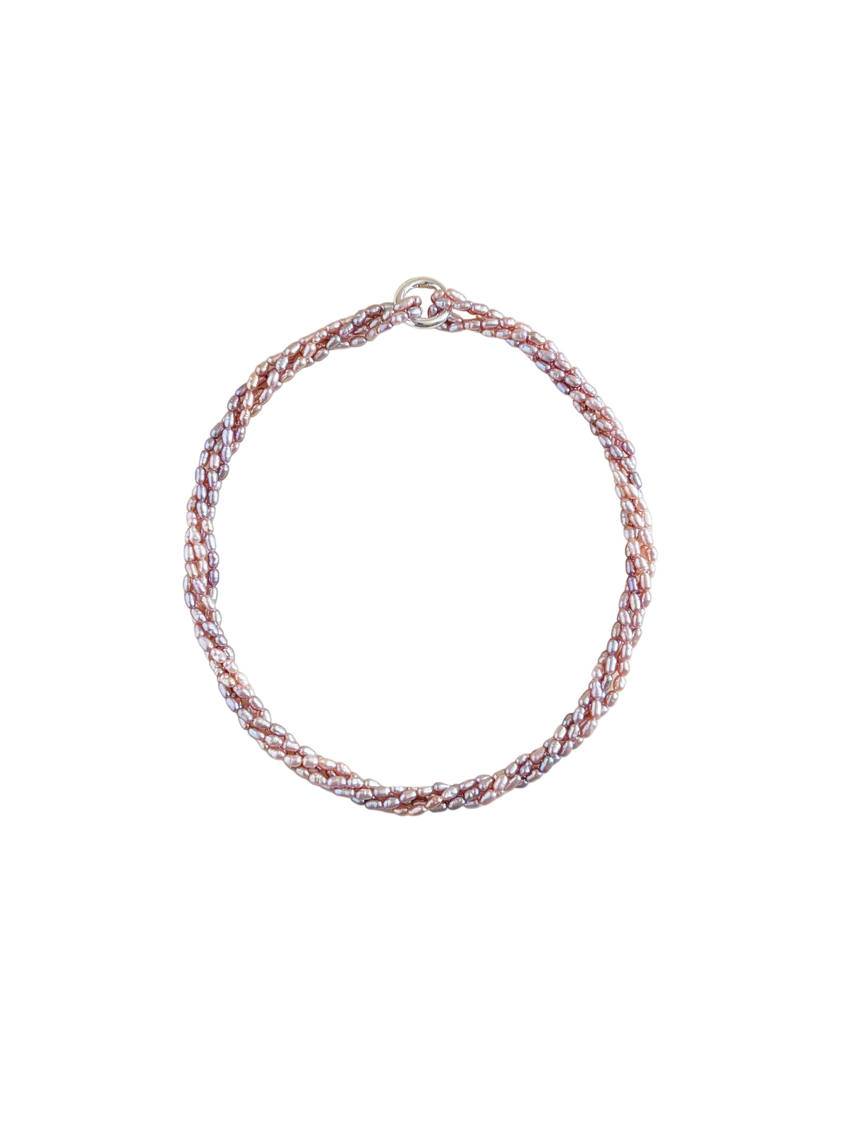A braided rice pearl multistrand necklace with a silver clasp displayed on a solid beige background.