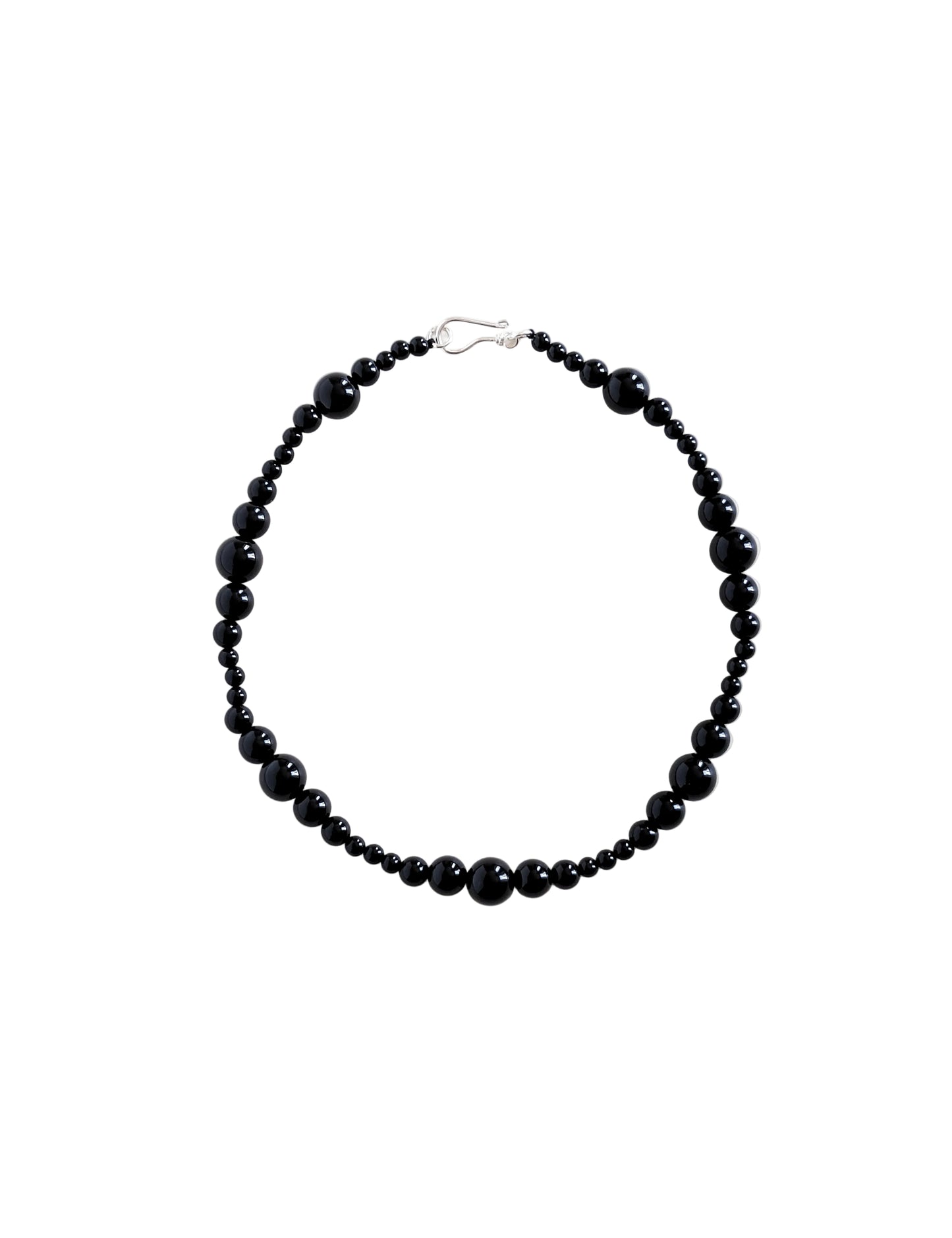 Black beaded necklace on a white background