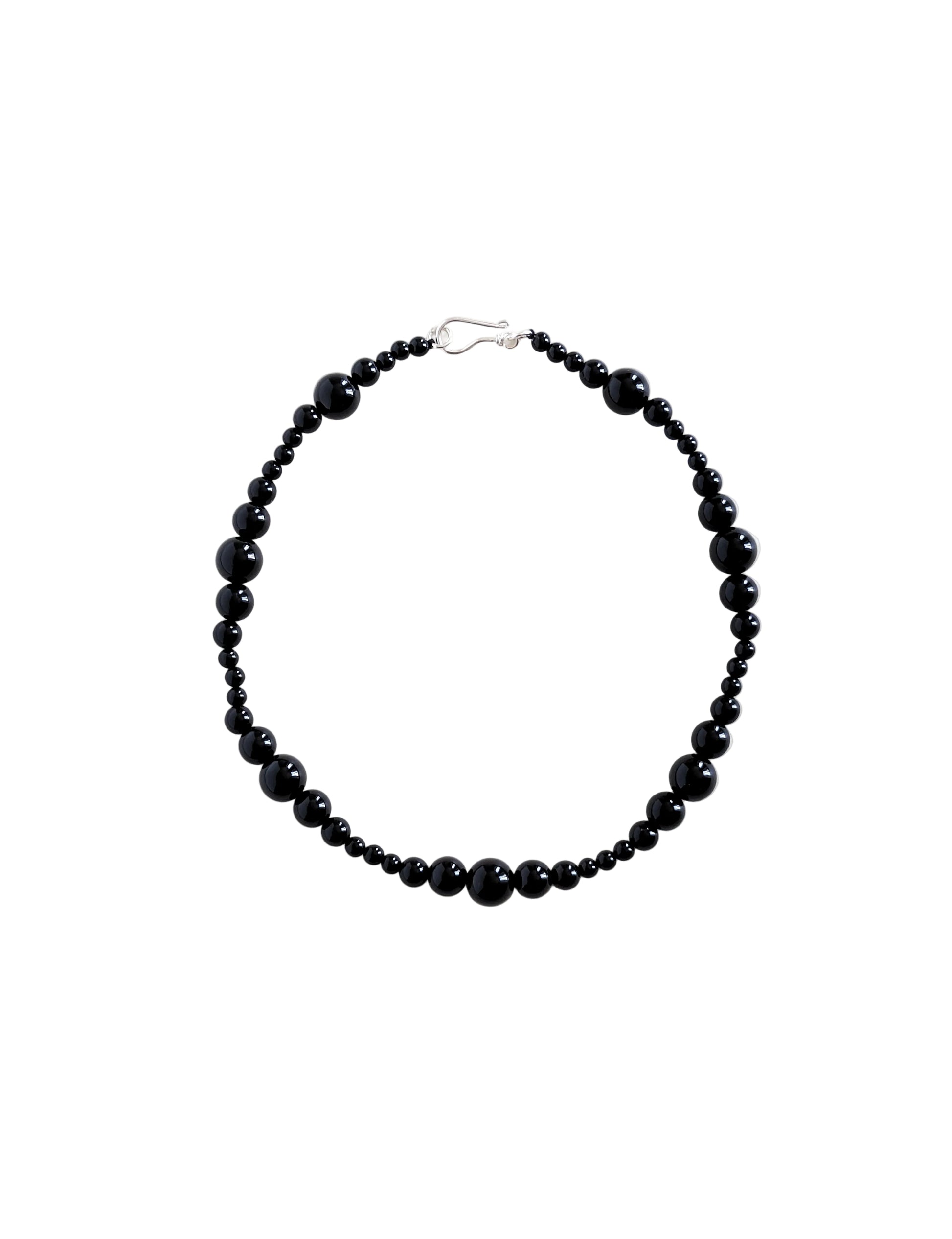 Black beaded necklace on a white background
